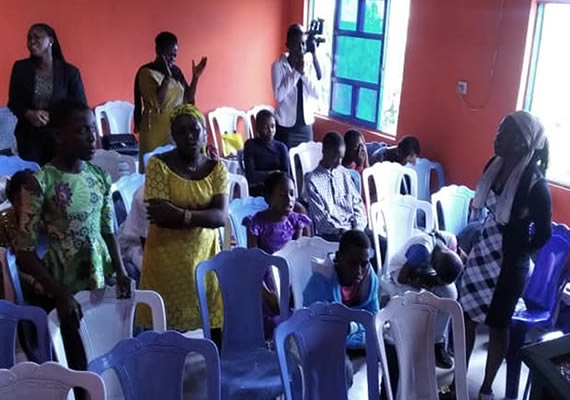 The Teenage Section of the Church, studying the Bible during a Sunday Service.