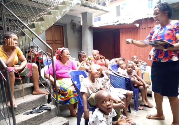 The Minister Rechel James preaching to a small congregation at Okrika